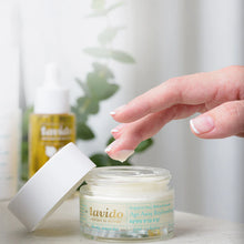 Load image into Gallery viewer, Hand reaching into an open jar of Lavido Age Away Replenishing Cream