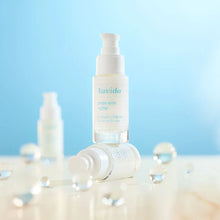 Load image into Gallery viewer, Lavido Collagen+ Firming Serum bottles with water droplets against a blue sky